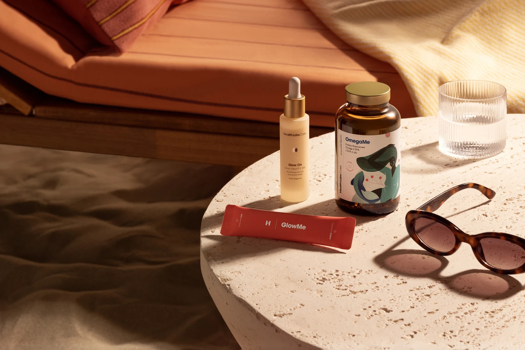 Health Labs Care supplements and skincare arranged on a sunlit stone table
